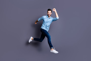 Fototapeta na wymiar Full length body size view portrait of his he nice attractive cheerful cheery optimistic macho guy having fun time isolated over gray violet purple pastel background