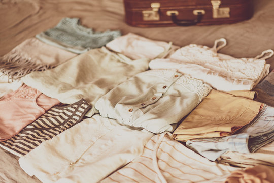 Summer Women's Clothing Neatly Folded To Be Packed In A Suitcase. Travel Suitcase Prepareing Concept.