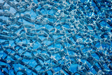 Broken tempered glass closeup. Broken window