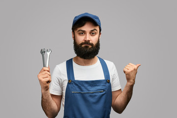 Confident mechanic pointing aside