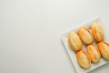 Whole grain wheat plain bread buns isolated on white background