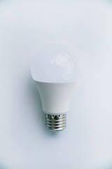 One LED lamp on a white background. Eco concept of saving electricity