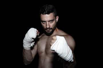 Wrestler with gloves and black background