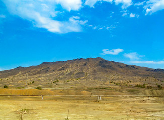 Environmental pollution, dirty industrial emissions from a copper smelter are destructive of nature. Landscape with mountains with lost forest near the town of Karabash, Chelyabinsk region, Russia.