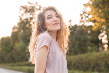 Beautiful young woman walking in the city
