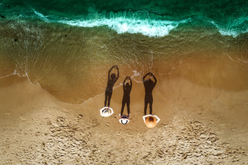 Aerial view of beach with family. Free space for your decoration and summer time. 