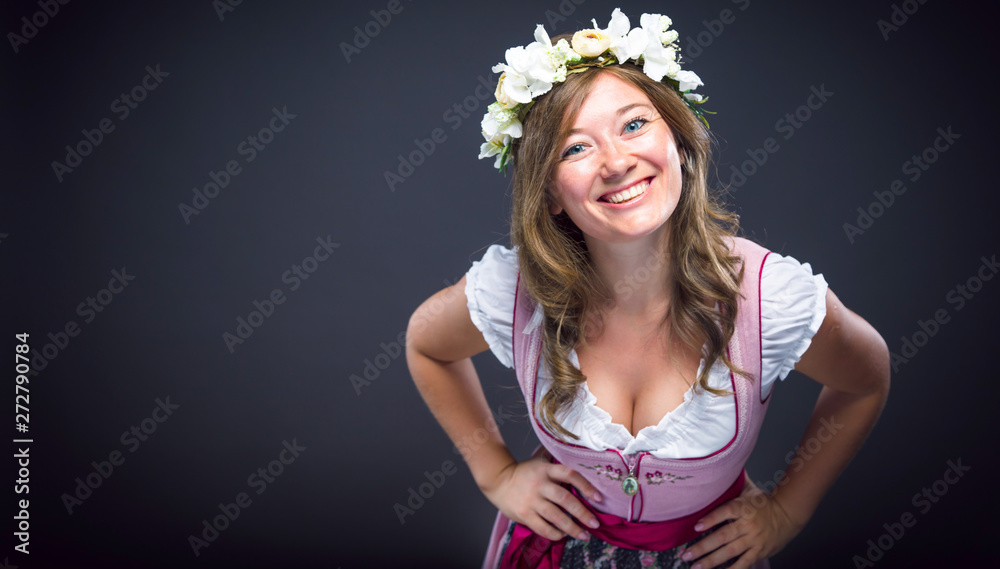 Wall mural Beautiful woman in a traditional bavarian dirndl