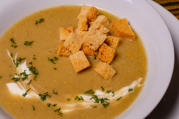 Minestrone, italian vegetable soup with pasta on wooden table. Top view
