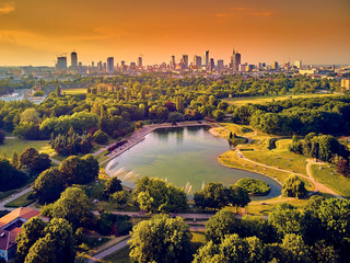 A beautiful panoramic view of the sunset in a fabulous evening in June from drone at Pola Mokotowskie in Warsaw, Poland - 