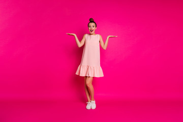 Full length body size view of her she nice charming attractive lovely glamorous cheerful cheery slim fit thin girl holding objects on palms isolated on bright vivid shine pink fuchsia background