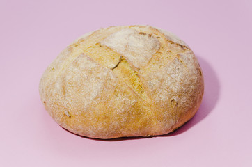 Fototapeta na wymiar Loaf of bread with color background