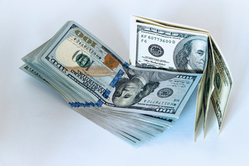 Stack of one hundred dollar bills new design on a white background