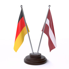 Germany and Latvia, two table flags isolated on white background. 3d image