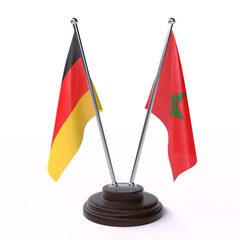 Germany and Morocco, two table flags isolated on white background. 3d image