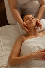 Partly-naked appealing lady with gentle smile having useful procedure