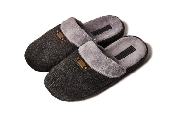 Gray textile slippers isolated on white background
