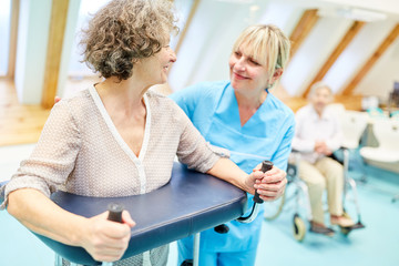 Senior woman with rollator in physiotherapy