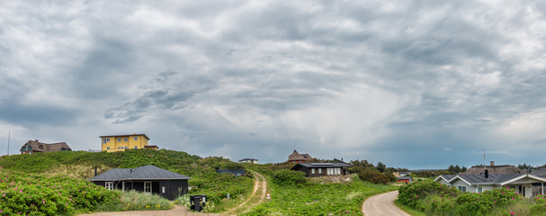 Fototapeta na wymiar Vacation homes houses in Henne at the North Sea coast in Denmark