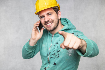 the building investor is talking on the phone and pointing to you