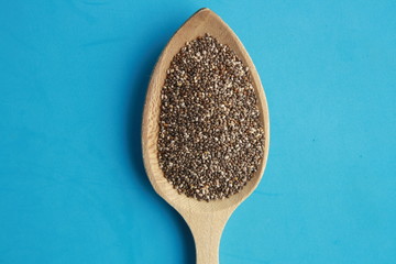 wooden spoon with black chia seeds