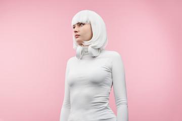 Futuristic female with headphones looking away
