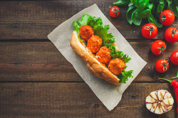 meatballs sandwich (snack with meat and vegetables). food background. top view. copy space