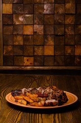 Grilled steak, French fries and vegetables