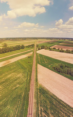 Fototapeta na wymiar Railroad track amongst rural area aerial view