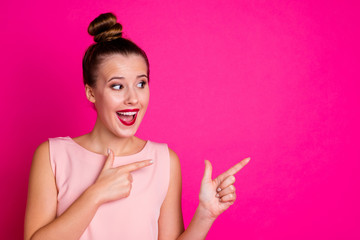 Portrait of cheerful lady feel rejoice content advertise promo choose choice decide decision laugh dressed top-knot fashionable glamorous isolated pink colorful bright background