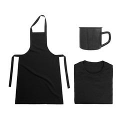 Collection of black objects isolated on white background. Black blank apron, black folded t-shirt, metal mug. Flat lay of branding or identity mockup design.