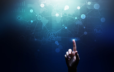 Mixed media. Business Organisational structure on virtual screen with process icons.