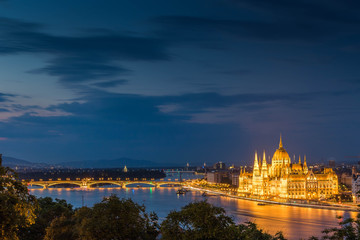 Illuminated aerial urbanscape of Budapestwith the Parliament building and the Margaret Bridge...