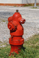 Fototapeta na wymiar Old street fire hydrant to extinguish a fire in the streets of the Portuguese capital of Lisbon