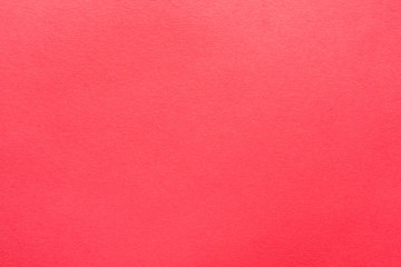 Vibrant coral pink felt texture abstract art background. Colored soft material surface. Copy space.
