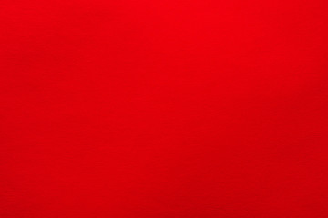 Red felt texture abstract art background. Solid color wool textile. Copy space.