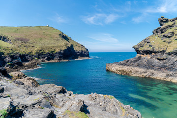 Fototapeta na wymiar rocky landscape in wales overlooking the sea with blue sky