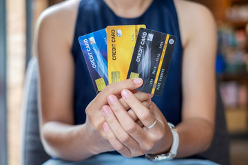 Young casual Business woman holding credit card  for online shopping while making orders in the cafe.business, lifestyle,technology,ecommerce and online payment concept