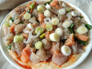  Raw fish pie with 2 types of fish and green onions, ready to be baked. Healthy homemade food concept.