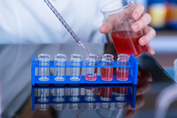 Using  pipette in the laboratory