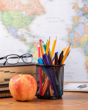 School Teachers Desk With World Map In Background