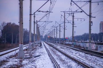 Winter Russian Railway. Public transport. winter road. Rails and sleepers. Electricity