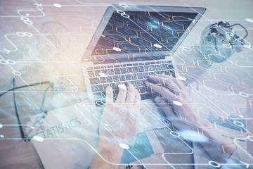 Businessman with computer background with technology theme hologram. Concept of big data. Double exposure.