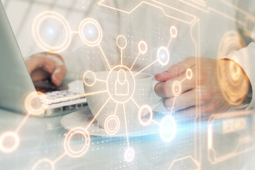 Social network theme hologram with businessman working on computer on background. Multi exposure.