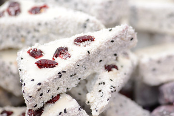 Triangle craft dessert decorated with coconut and dried fruit