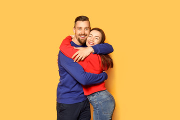 Obraz premium Happy young couple on color background