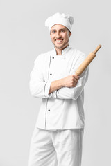 Handsome male chef on white background