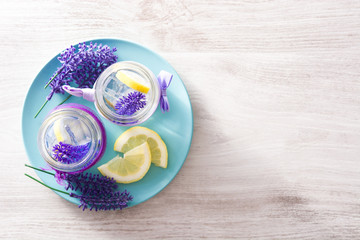 Lavender lemonade drink on white wooden table