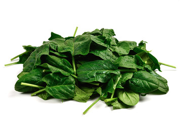 Fresh spinach leaves as background.
