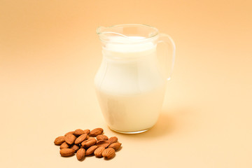 A jar with almond milk, nuts. Space for text or design.