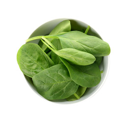 Bowl with fresh spinach on white background